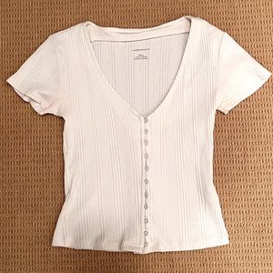 Anthropologie fitted cream shirt with ribbing and buttons